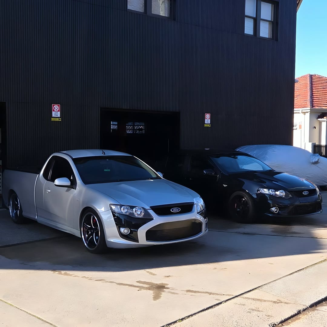 Utes parked outside the workshop on Bunnerong Road